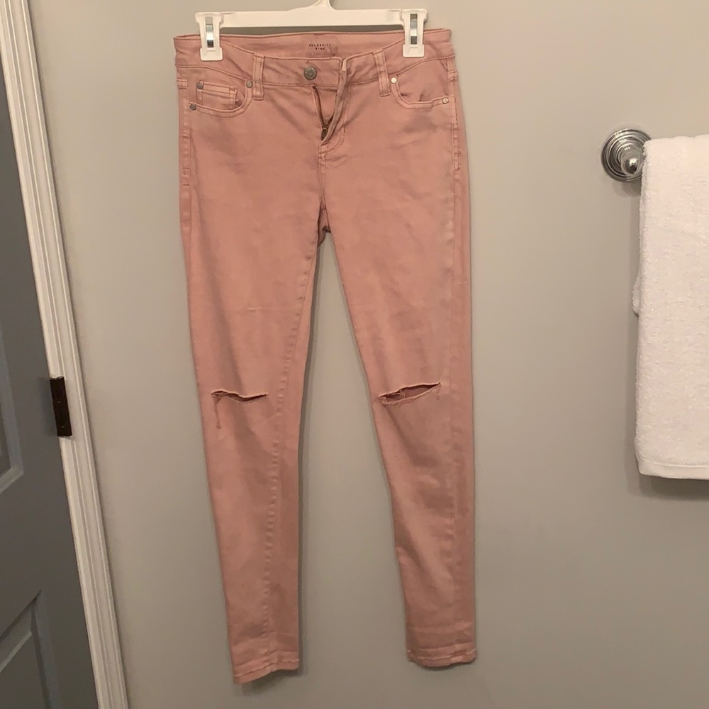 “Celebrity Pink” light pink ripped jeans